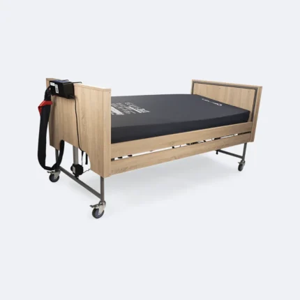 Turn All PressureCare kantelsysteem op een zorgbed, met aandrijfunit aan het hoofdeinde en zwart matras.
